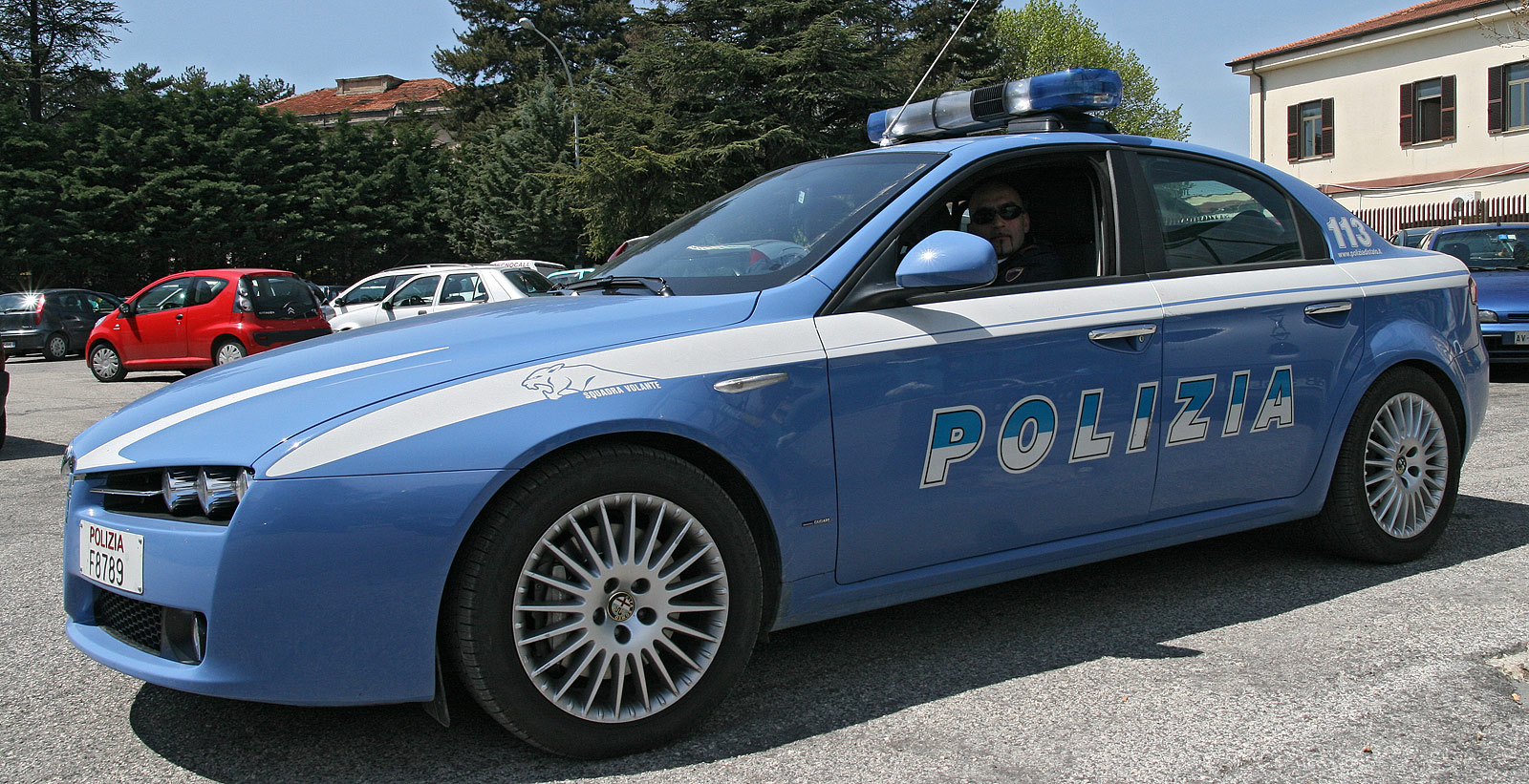 Arancia E Lampeggiante Blu Del Volante Della Polizia Immagine